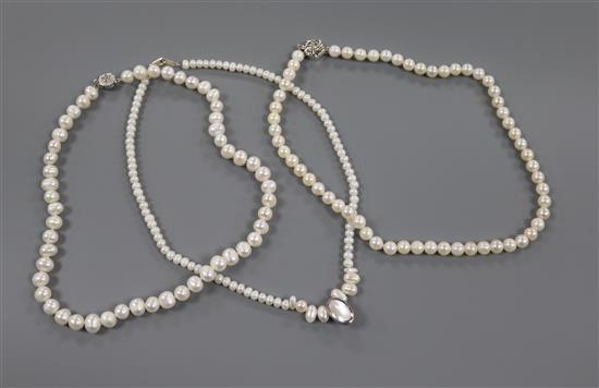 Three assorted single strand cultured pearl necklaces with 925 clasps.